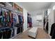 Organized walk-in closet with custom shelving, rods, and ample storage space at 13090 Bromborough Dr, Orlando, FL 32832
