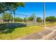 Enjoy a game of basketball at the community court, surrounded by lush greenery and black chain link fence for secure play at 133 Reserve Cir # 109, Oviedo, FL 32765