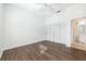 Spacious bedroom features wood flooring, closet and bathroom access at 133 Reserve Cir # 109, Oviedo, FL 32765
