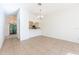 Open floor plan with dining area leading to a screened porch and the kitchen at 133 Reserve Cir # 109, Oviedo, FL 32765