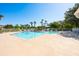 A bright and refreshing pool area featuring sun loungers and palm trees at 133 Reserve Cir # 109, Oviedo, FL 32765
