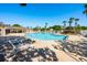 Beautiful pool with lounge chairs, palm trees, and clear blue skies, perfect for relaxation at 133 Reserve Cir # 109, Oviedo, FL 32765