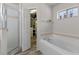Bathroom featuring a walk-in shower and a separate soaking tub at 14750 Hartford Run Dr, Orlando, FL 32828