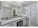 Bathroom with double sinks, granite countertops, and walk-in shower at 14750 Hartford Run Dr, Orlando, FL 32828