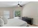 Bedroom with a ceiling fan and sliding glass door to the lanai at 14750 Hartford Run Dr, Orlando, FL 32828