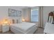 Bright bedroom with natural light, neutral walls, cozy carpets, and elegant decor creates a relaxing atmosphere at 14750 Hartford Run Dr, Orlando, FL 32828