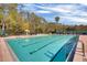 Large community pool with plenty of tanning beds and chairs, perfect for summer days at 14750 Hartford Run Dr, Orlando, FL 32828