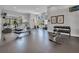 Bright fitness center with modern equipment, including a rower, treadmill, and dumbbell rack with weights at 14750 Hartford Run Dr, Orlando, FL 32828