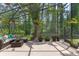 Screened-in patio with comfortable seating and lush greenery offers a serene outdoor living space at 14750 Hartford Run Dr, Orlando, FL 32828