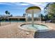 Fun splash pad and community pool area for , surrounded by lounge chairs and umbrellas at 14750 Hartford Run Dr, Orlando, FL 32828