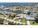 Wide aerial shot of the property and neighborhood featuring waterfront views, canals and pools at 151 Sea Isle Cir, South Daytona, FL 32119