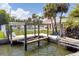 Outdoor entertaining is easy in this backyard, complete with a boat lift at 151 Sea Isle Cir, South Daytona, FL 32119