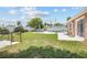 A sprawling lawn features a patio with an in-ground pool, outdoor kitchen and convenient access to the house at 151 Sea Isle Cir, South Daytona, FL 32119