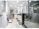 Updated bathroom featuring a glass walk-in shower, dual sinks and tile floors at 151 Sea Isle Cir, South Daytona, FL 32119