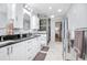 Bright bathroom with granite counters, dual sinks and tiled walk-in shower at 151 Sea Isle Cir, South Daytona, FL 32119