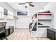 Cozy bedroom with bunk beds, a desk, and ample natural light at 151 Sea Isle Cir, South Daytona, FL 32119