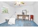 Bright bedroom with a large window, vanity and carpeted floor at 151 Sea Isle Cir, South Daytona, FL 32119