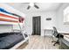 bedroom with bunk beds and desk with modern flooring at 151 Sea Isle Cir, South Daytona, FL 32119