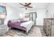 Cozy bedroom with wood-look floors and a ceiling fan provides comfort at 151 Sea Isle Cir, South Daytona, FL 32119