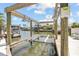 This waterfront home features a private boat lift for easy access to the open water at 151 Sea Isle Cir, South Daytona, FL 32119