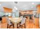 Inviting dining room area integrated with the kitchen, featuring hardwood floors and abundant lighting at 151 Sea Isle Cir, South Daytona, FL 32119