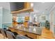 Open kitchen bar with pendant lighting, and comfortable seating providing a cozy and social area at 151 Sea Isle Cir, South Daytona, FL 32119