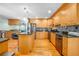 Modern kitchen with granite countertops, stainless steel appliances, hardwood floors, and ample cabinet space at 151 Sea Isle Cir, South Daytona, FL 32119