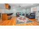 Comfortable living room with modern furnishings, hardwood floors, and a mini-bar with seating, offering relaxation at 151 Sea Isle Cir, South Daytona, FL 32119