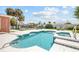 Sparkling swimming pool with a hot tub surrounded by lush landscaping at 151 Sea Isle Cir, South Daytona, FL 32119