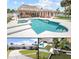 Inviting outdoor space featuring a large pool, tiki bar, and well-maintained landscaping in a waterfront property at 151 Sea Isle Cir, South Daytona, FL 32119