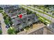 Aerial view of townhome community with manicured landscaping and convenient access to local roadways at 1516 Resolute St, Celebration, FL 34747