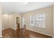 Upstairs bedroom features hardwood floors, base trim and neutral walls with a view of the bath at 1516 Resolute St, Celebration, FL 34747