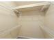 Walk-in closet features adjustable shelving and carpeting providing ample storage space for organization at 1516 Resolute St, Celebration, FL 34747