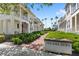Picturesque Twin Oaks Mews community entrance with lush landscaping and charming homes at 1516 Resolute St, Celebration, FL 34747