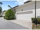 Exterior angle showcasing a clean two-car garage door set in a modern home at 1516 Resolute St, Celebration, FL 34747