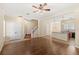 Open concept living and kitchen area with hardwood floors and neutral paint colors at 1516 Resolute St, Celebration, FL 34747