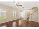 Spacious living room with hardwood floors, neutral walls, and staircase at 1516 Resolute St, Celebration, FL 34747