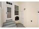 Charming outdoor patio with steps, white trim, and a conveniently placed utility door at 1516 Resolute St, Celebration, FL 34747