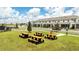 Outdoor picnic area featuring multiple picnic tables and community green space at 16284 Hamlin View St, Winter Garden, FL 34787