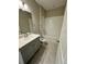 Full bathroom featuring a shower and tub with ceramic tile and vanity at 16290 Hamlin View St, Winter Garden, FL 34787