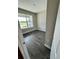 Bright bedroom with a large window and wood flooring at 16290 Hamlin View St, Winter Garden, FL 34787