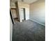 A carpeted bedroom with closet and neutral walls at 16290 Hamlin View St, Winter Garden, FL 34787