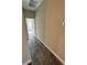 Hallway with neutral colored walls and plush carpet at 16290 Hamlin View St, Winter Garden, FL 34787