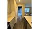 Bright kitchen featuring modern appliances and countertops connecting to adjacent living spaces at 16290 Hamlin View St, Winter Garden, FL 34787