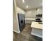 Stylish kitchen equipped with stainless steel appliances, ample cabinet space, and sleek countertops at 16290 Hamlin View St, Winter Garden, FL 34787