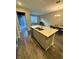 Open concept kitchen with a large island and stainless steel appliances at 16290 Hamlin View St, Winter Garden, FL 34787