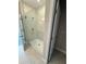 Modern bathroom with glass shower doors and bright lighting at 16290 Hamlin View St, Winter Garden, FL 34787
