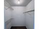A walk-in closet offers ample storage space with shelving for organized living at 1908 Lake Atriums Cir # 20, Orlando, FL 32839