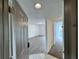View of condo entrance with tile flooring and entry to living space with laminate flooring at 1908 Lake Atriums Cir # 20, Orlando, FL 32839