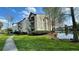 Exterior view of building with lakeside location, lush green lawn, and ample parking at 1908 Lake Atriums Cir # 20, Orlando, FL 32839